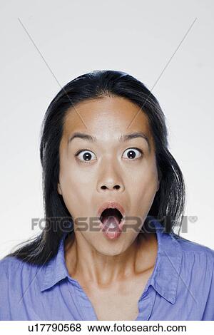 Portrait of surprised young woman, studio shot View Large Photo Image Stock Photo - Portrait of surprised young woman, studio shot. Fotosearch