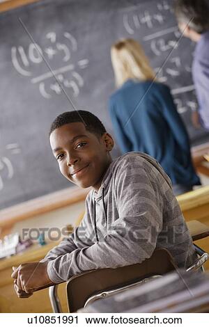 Portrait of teenage boy (14-15) at school View Large Photo Image Stock Image - Portrait of teenage boy (14-15) at school. Fotosearch