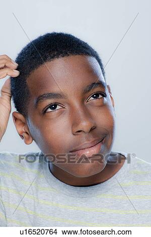 Picture - Portrait of teenage boy (14-15), studio shot. Fotosearch