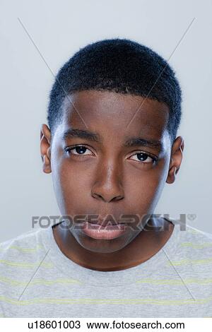 Portrait of teenage boy (14-15), studio shot View Large Photo Image Stock Image - Portrait of teenage boy (14-15), studio shot. Fotosearch