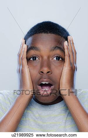 Portrait of teenage boy (14-15), studio shot View Large Photo Image Stock Photography - Portrait of teenage boy (14-15), studio shot. Fotosearch