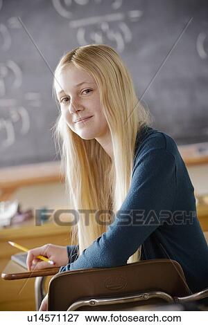 Stock Photo - Portrait of teenage girl (14-15) at school. Fotosearch