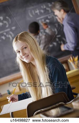 Stock Photo - Portrait of teenage girl (14-15) at school. Fotosearch
