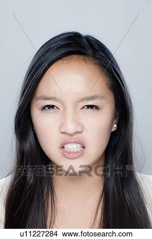 Picture - Portrait of teenage girl (14-15), studio shot. Fotosearch