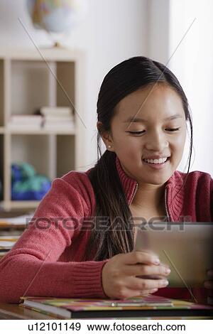 Stock Photo - Portrait of teenage girl (14-15). Fotosearch