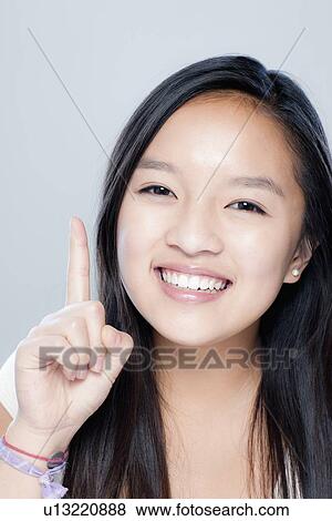 Portrait of teenage girl (14-15), studio shot View Large Photo Image Stock Photo - Portrait of teenage girl (14-15), studio shot. Fotosearch