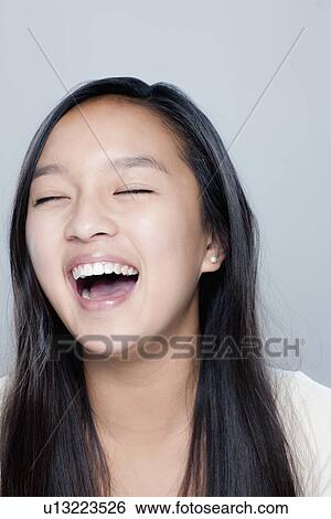 Portrait of teenage girl (14-15), studio shot View Large Photo Image Stock Photograph - Portrait of teenage girl (14-15), studio shot. Fotosearch