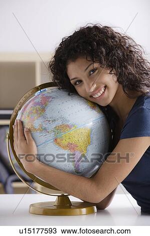 Portrait of teenage girl (16-17) with globe View Large Photo Image Stock Image - Portrait of teenage girl (16-17) with globe. Fotosearch