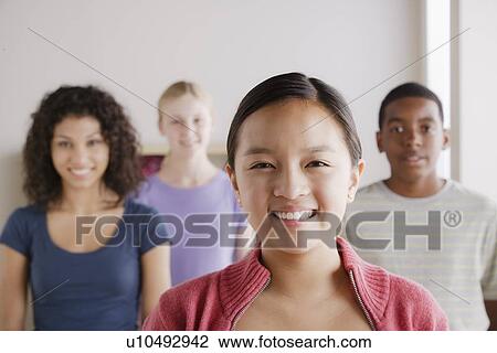 Stock Image - Portrait of teenage students (14-15, 16-17). Fotosearch