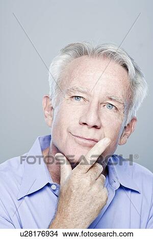 Portrait of thoughtful senior man, studio shot View Large Photo Image Picture - Portrait of thoughtful senior man, studio shot. Fotosearch