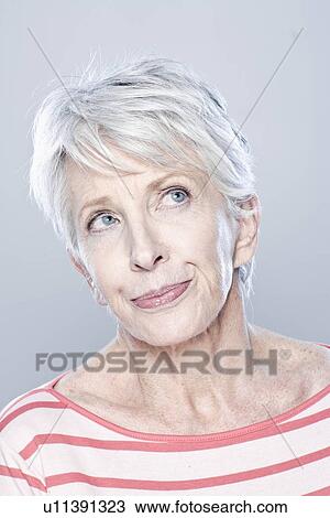 Portrait of thoughtful senior woman, studio shot View Large Photo Image Stock Image - Portrait of thoughtful senior woman, studio shot. Fotosearch