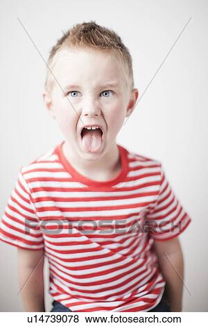 Portrait of toddler boy (2-3) sticking out tongue View Large Photo Image Stock Photo - Portrait of toddler boy (2-3) sticking out tongue. Fotosearch