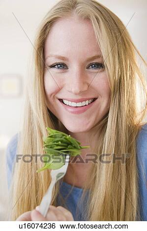 Portrait of woman eating salad View Large Photo Image Stock Photograph - Portrait of woman eating salad. Fotosearch
