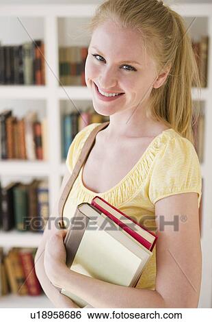 Portrait of woman with books View Large Photo Image Stock Photograph - Portrait of woman with books. Fotosearch