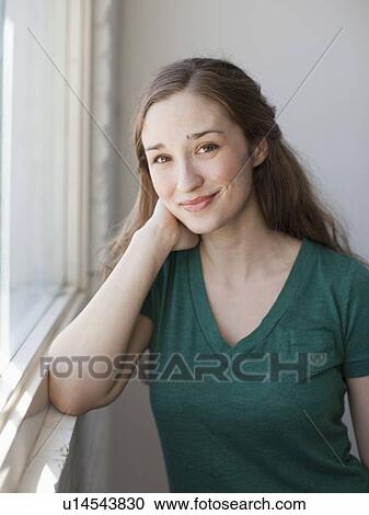 Stock Image - Portrait of young attractive woman. Fotosearch