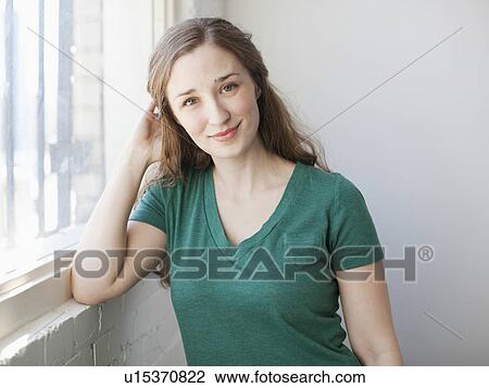 Stock Image - Portrait of young attractive woman. Fotosearch
