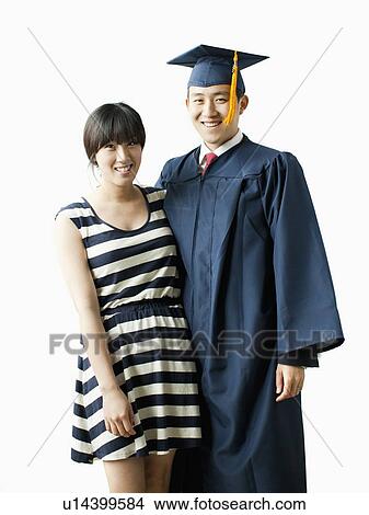 Portrait of young couple, man in graduation gown View Large Photo Image Picture - Portrait of young couple, man in graduation gown. Fotosearch