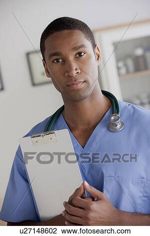 Stock Image - Portrait of young doctor. Fotosearch