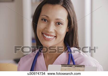 Portrait of young female doctor View Large Photo Image Picture - Portrait of young female doctor. Fotosearch