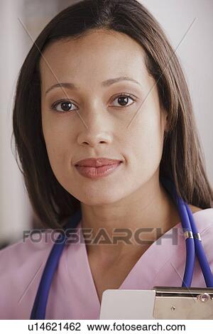 Portrait of young female doctor View Large Photo Image Stock Image - Portrait of young female doctor. Fotosearch