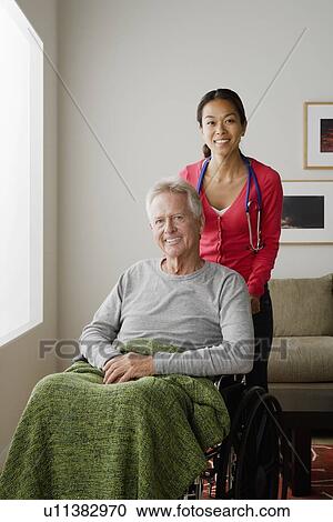 Portrait of young female nurse and senior man View Large Photo Image Stock Image - Portrait of young female nurse and senior man. Fotosearch
