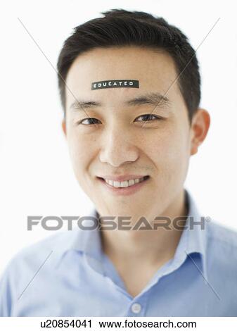 Portrait of young man with word educated on forehead, studio shot View Large Photo Image Stock Image - Portrait of young man with word educated on forehead, studio shot. Fotosearch