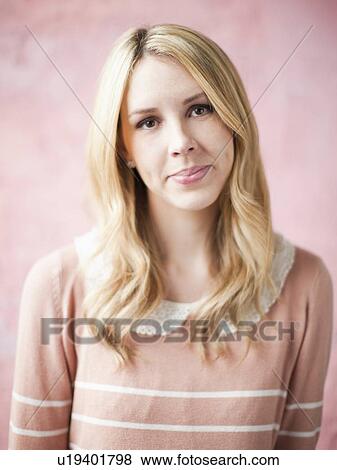 Portrait of young smiling woman, studio shot View Large Photo Image Stock Photo - Portrait of young smiling woman, studio shot. Fotosearch