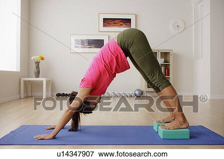 Stock Photo - Portrait of young woman during fitness. Fotosearch