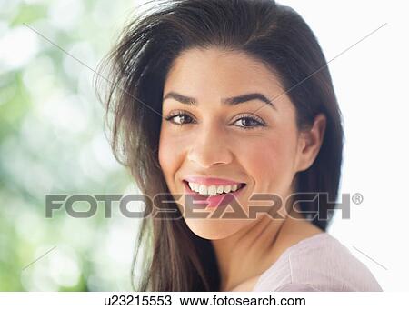 Portrait of young woman smiling View Large Photo Image Stock Image - Portrait of young woman smiling. Fotosearch