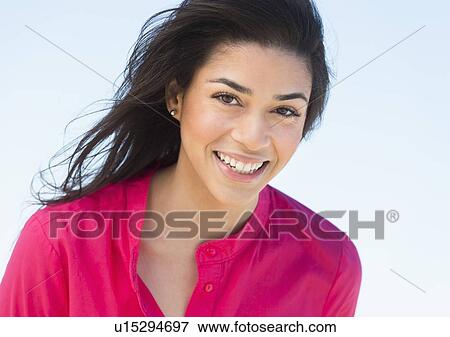 Portrait of young woman smiling View Large Photo Image Stock Photo - Portrait of young woman smiling. Fotosearch