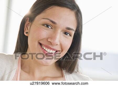 Portrait of young woman smiling View Large Photo Image Stock Photograph - Portrait of young woman smiling. Fotosearch