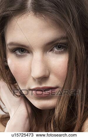 Stock Image - Portrait of young woman. Fotosearch