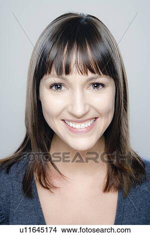 Portrait of young woman, studio shot View Large Photo Image Picture - Portrait of young woman, studio shot. Fotosearch