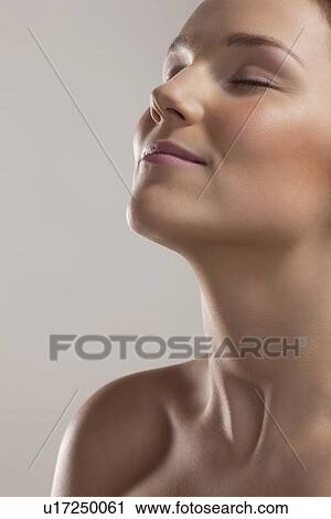 Portrait of young woman with eyes closed View Large Photo Image Stock Image - Portrait of young woman with eyes closed. Fotosearch
