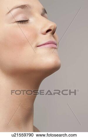 Portrait of young woman with eyes closed View Large Photo Image Stock Image - Portrait of young woman with eyes closed. Fotosearch