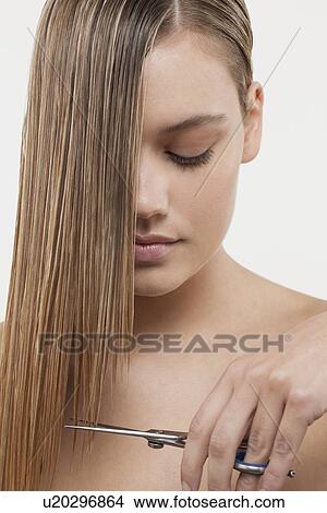 Portrait of young woman with wet hair and scissors View Large Photo Image Picture - Portrait of young woman with wet hair and scissors. Fotosearch