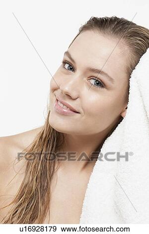 Portrait of young woman with wet hair and towel View Large Photo Image Stock Photo - Portrait of young woman with wet hair and towel. Fotosearch