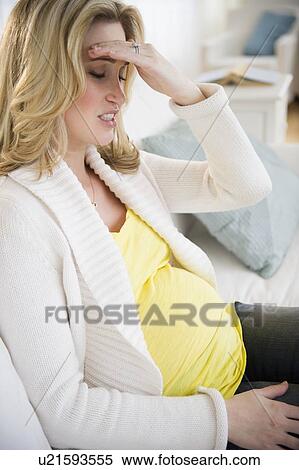 Pregnant woman with head in hands View Large Photo Image Stock Photography - Pregnant woman with head in hands. Fotosearch