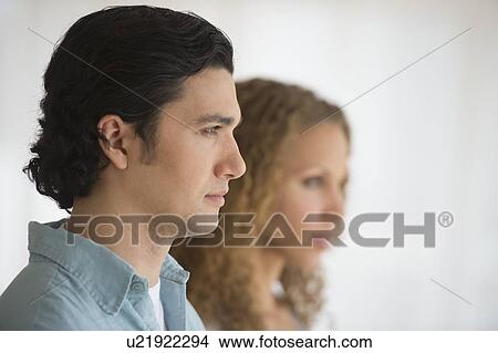 Profile of couple with focus on man in foreground View Large Photo Image Picture - Profile of couple with focus on man in foreground. Fotosearch