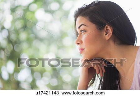 Stock Image - Profile of young woman. Fotosearch