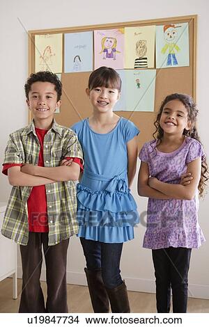 Picture - Pupils in classroom. Fotosearch