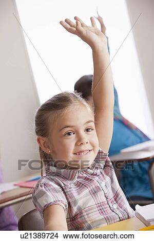 Pupils in classroom raising hands View Large Photo Image Picture - Pupils in classroom raising hands. Fotosearch