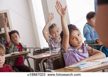 Pupils in classroom raising hands View Large Photo Image Stock Image - Pupils in classroom raising hands. Fotosearch