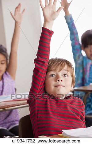 Pupils in classroom raising hands View Large Photo Image Stock Image - Pupils in classroom raising hands. Fotosearch