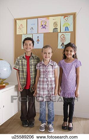 Stock Photograph - Pupils in classroom. Fotosearch