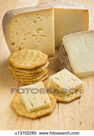 Pyrennes cow cheese with crackers View Large Photo Image Stock Photography - Pyrennes cow cheese with crackers. Fotosearch