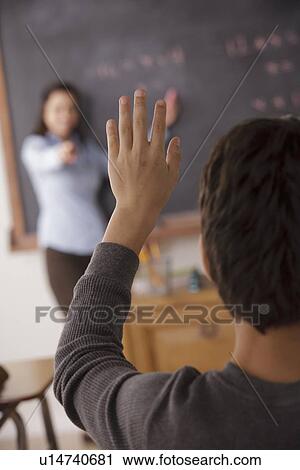 Stock Image - Schoolboy (12-13) at school. Fotosearch