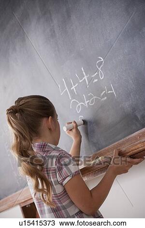 Schoolboy writing on blackboard View Large Photo Image Stock Image - Schoolboy writing on blackboard. Fotosearch