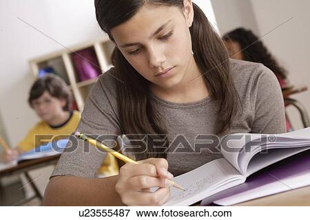 Stock Photo - Schoolgirl (12-13) at school. Fotosearch