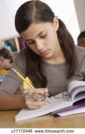 Stock Photograph - Schoolgirl (12-13) at school. Fotosearch